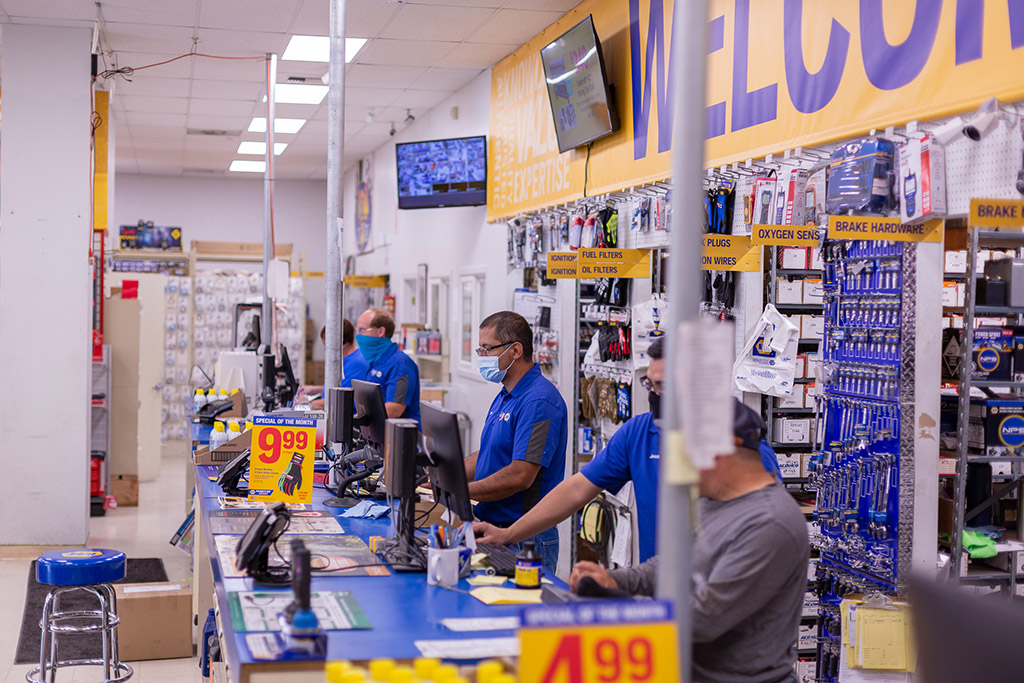 Jerry's Auto Supply employess at registers.